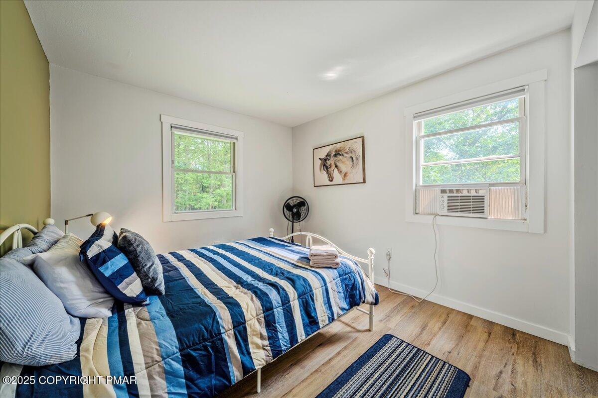 2102 Woodland Court Pocono Summit, PA 18346 - Photo 27 of 42 a bed room with a bed and a window