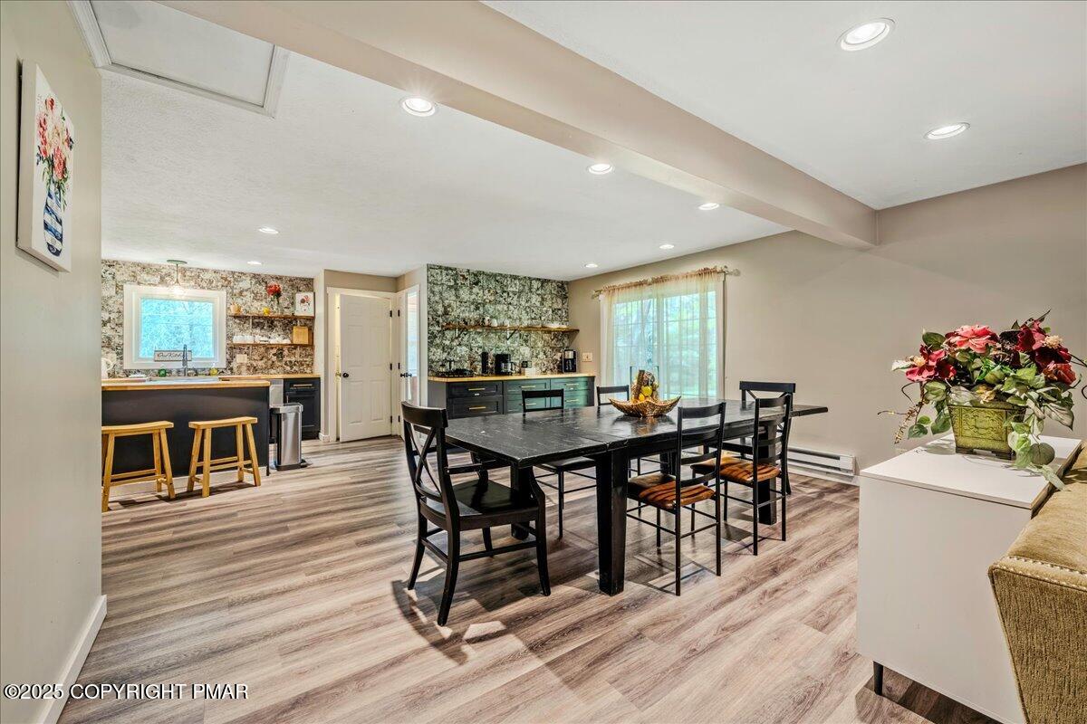 2102 Woodland Court Pocono Summit, PA 18346 - Photo 3 of 42 a view of a dining room with furniture and wooden floor