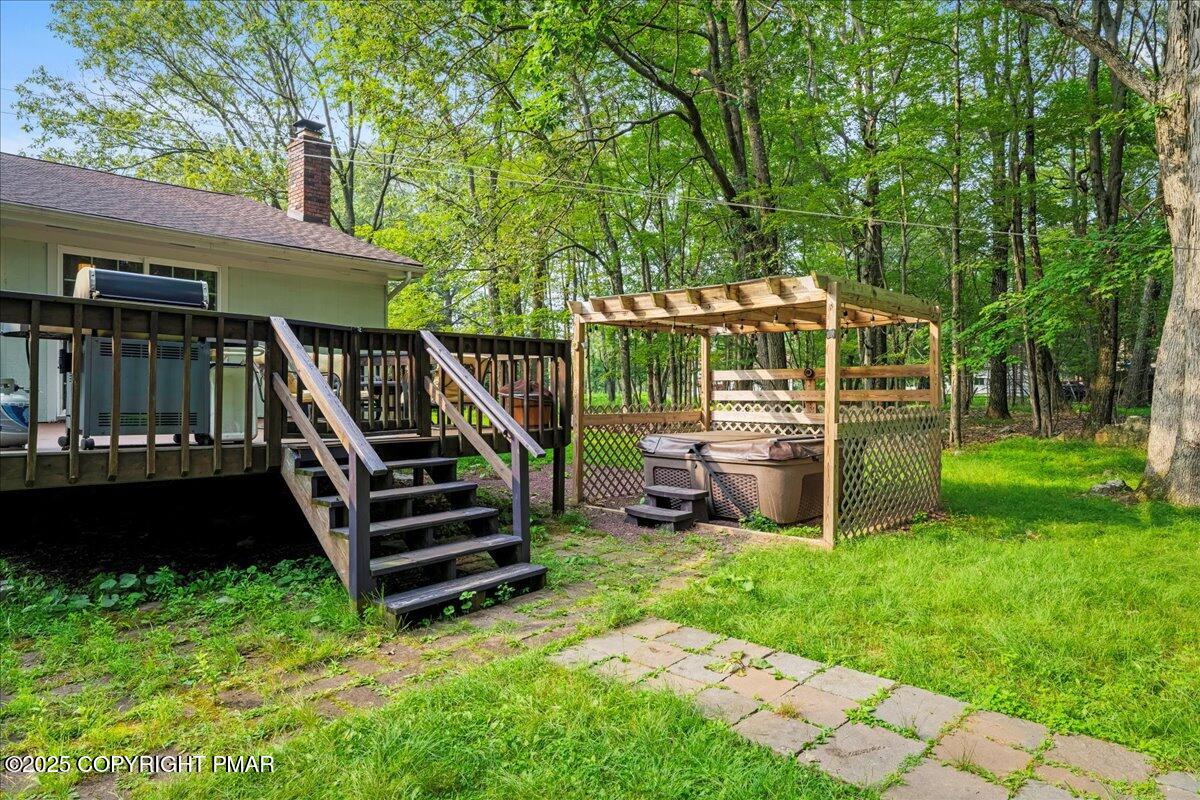 2102 Woodland Court Pocono Summit, PA 18346 - Photo 37 of 42 a view of a chair and table in the garden