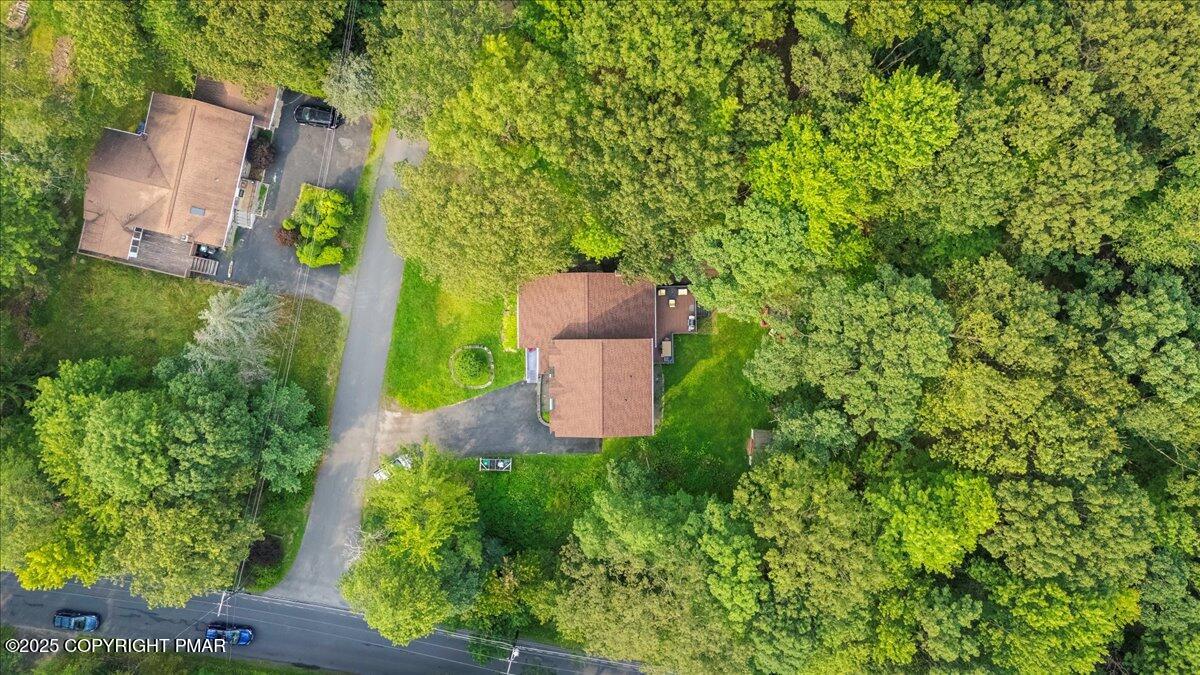 2102 Woodland Court Pocono Summit, PA 18346 - Photo 40 of 42 an aerial view of a house with a yard basket ball court and outdoor seating