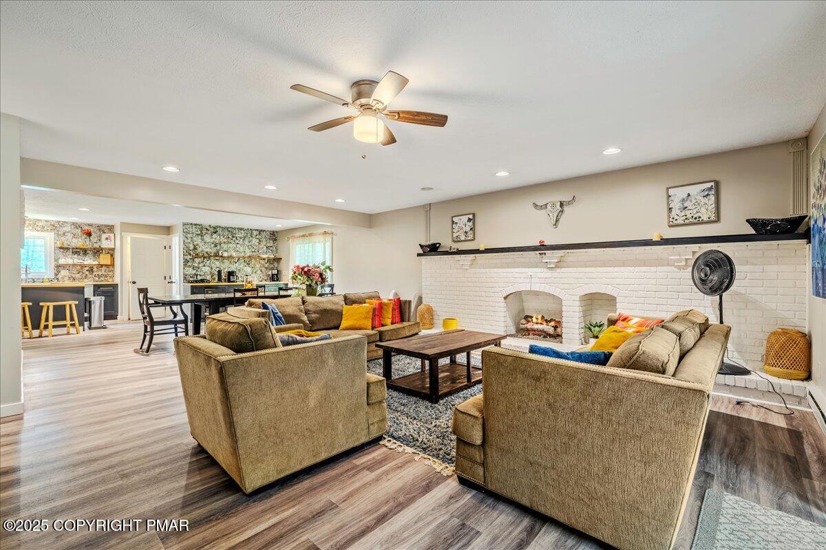 2102 Woodland Court Pocono Summit, PA 18346 - Photo 7 of 42 a living room with furniture and kitchen view