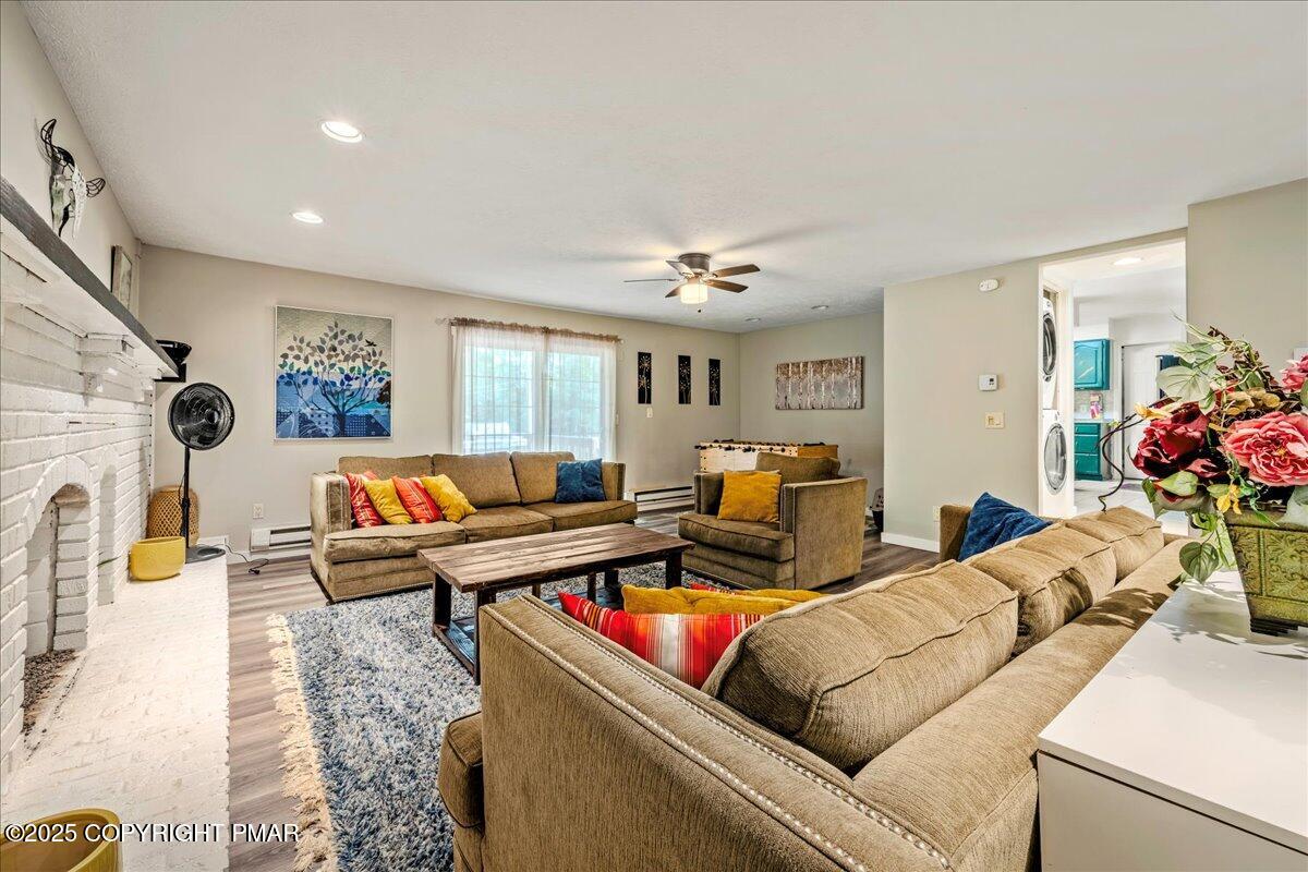 2102 Woodland Court Pocono Summit, PA 18346 - Photo 8 of 42 a living room with furniture and a flat screen tv