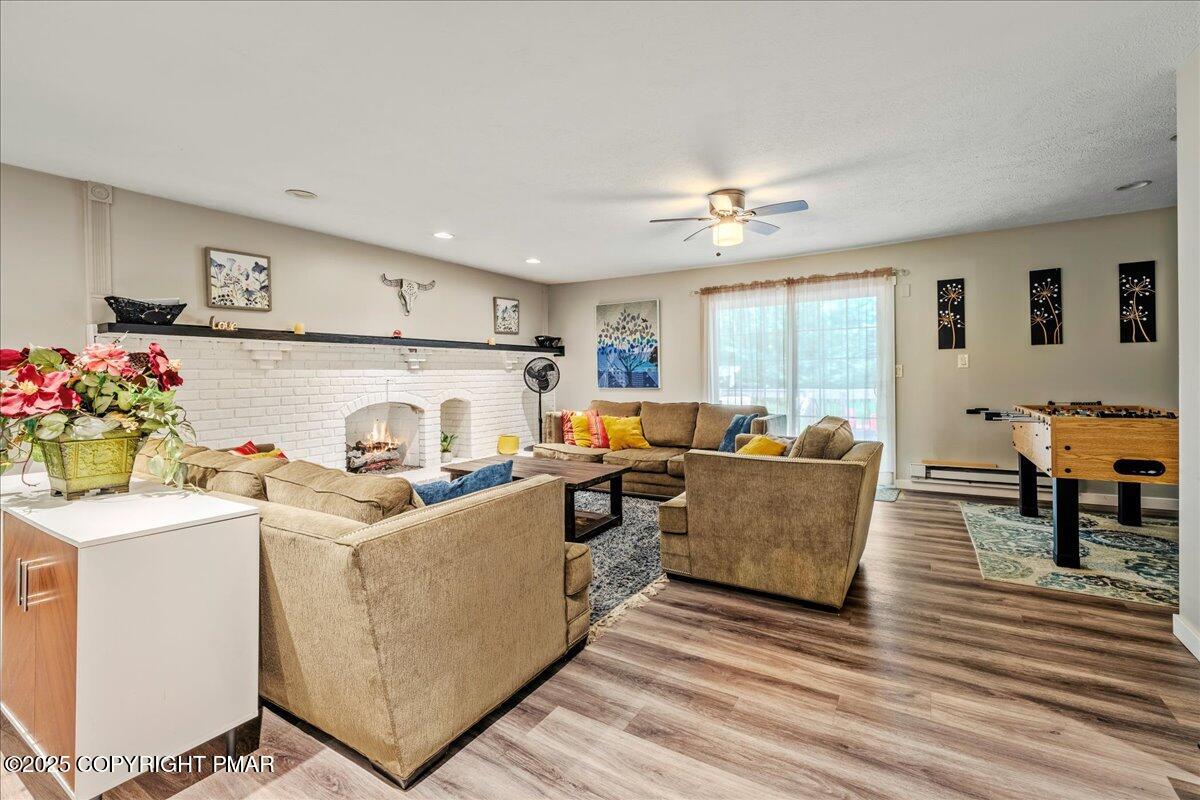 2102 Woodland Court Pocono Summit, PA 18346 - Photo 9 of 42 a living room with furniture and a window