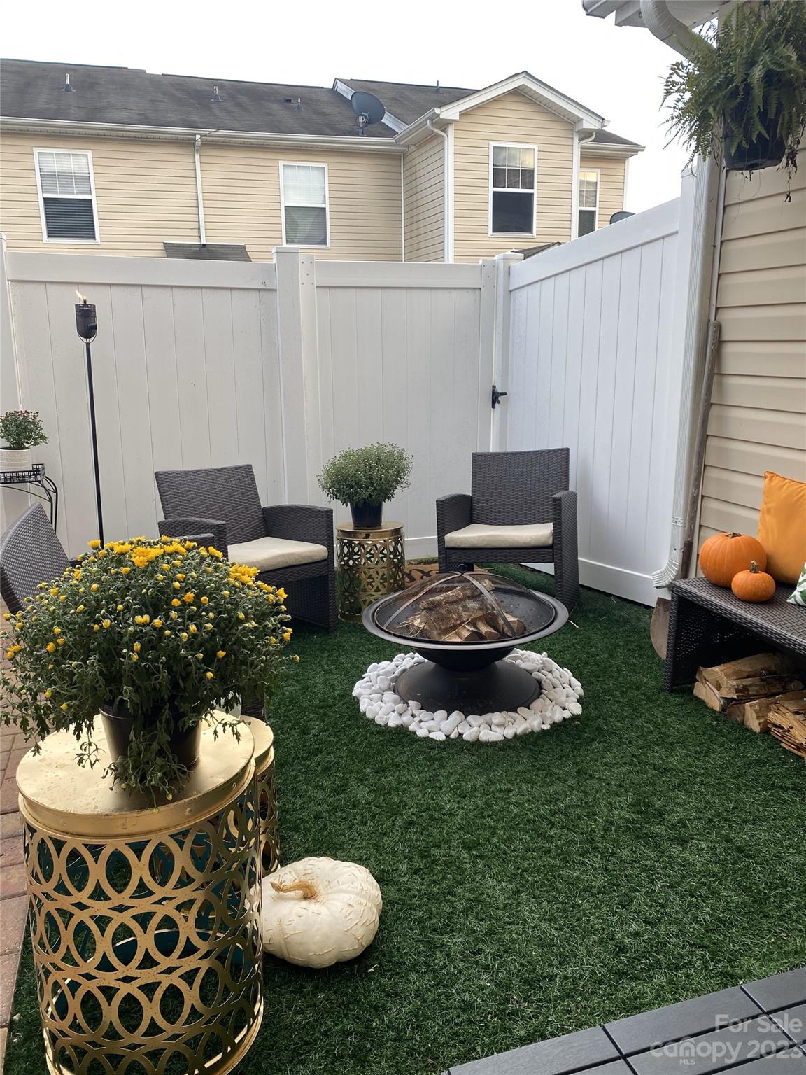 303 River Clay Road, Unit 135 Fort Mill, SC 29708 - Photo 16 of 19 a view of a backyard with plants and a patio