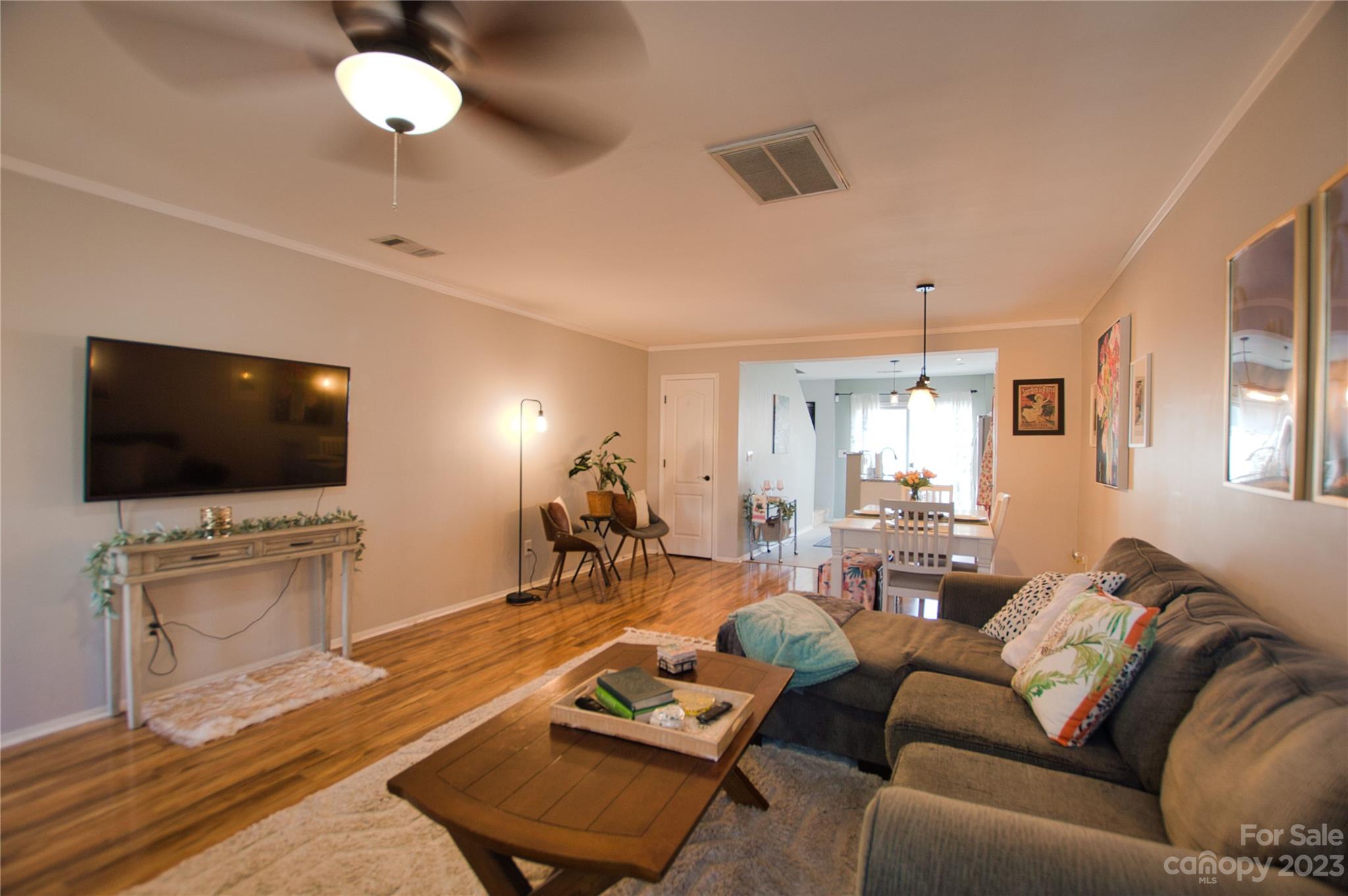 303 River Clay Road, Unit 135 Fort Mill, SC 29708 - Photo 4 of 19 a living room with furniture and a flat screen tv