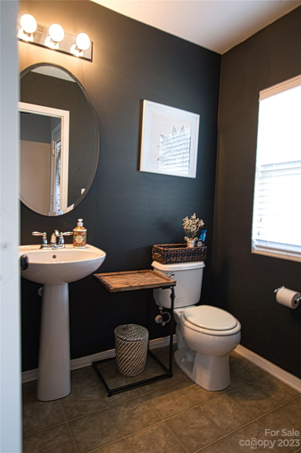 303 River Clay Road, Unit 135 Fort Mill, SC 29708 - Photo 8 of 19 a bathroom with a toilet sink and mirror