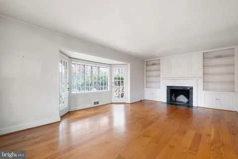 a view of a patio with a table and chairs