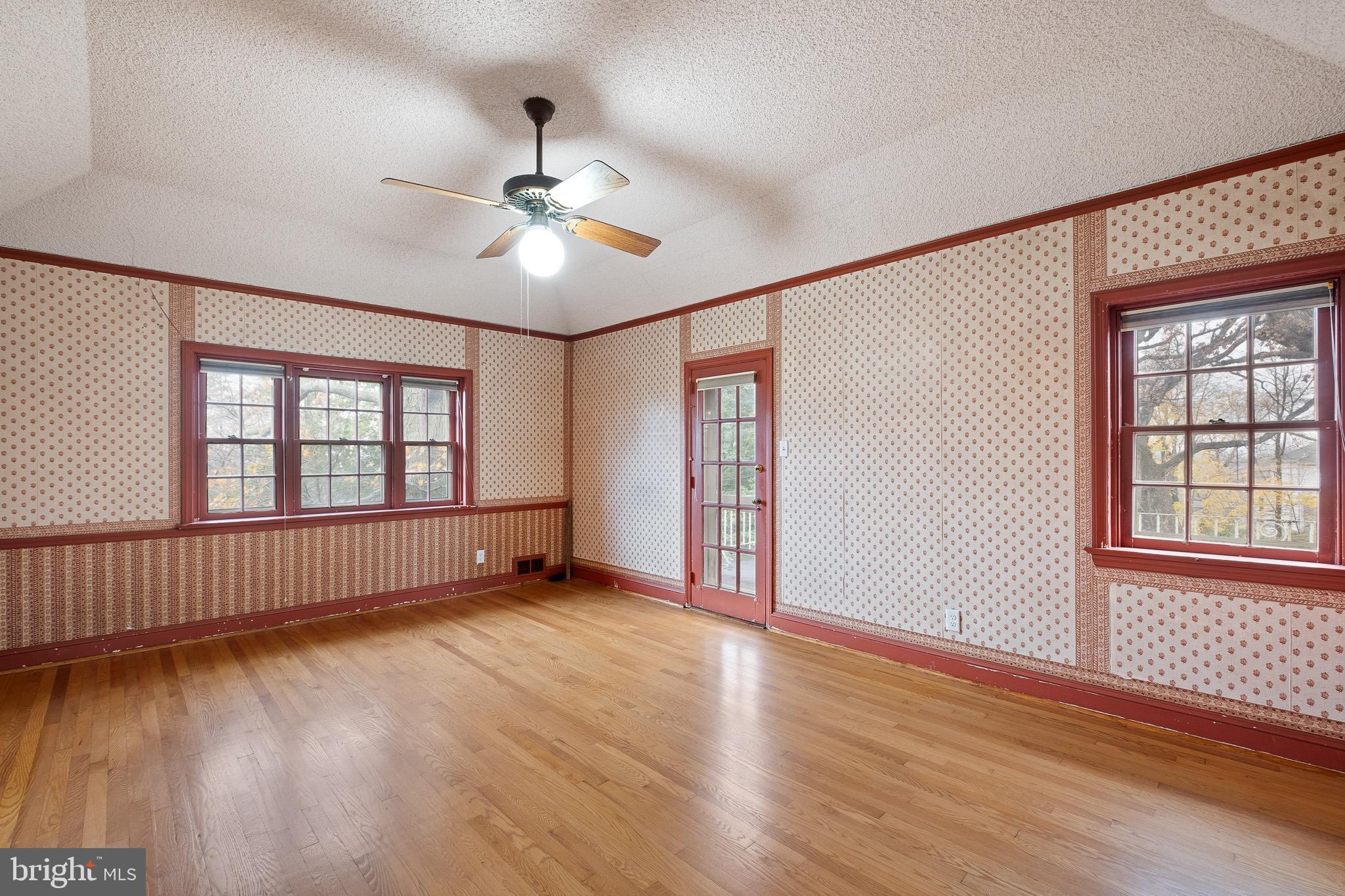 5 Blue Rock Road Wilmington, DE 19809 - Photo 29 of 42 a view of an empty room with wooden floor and a window