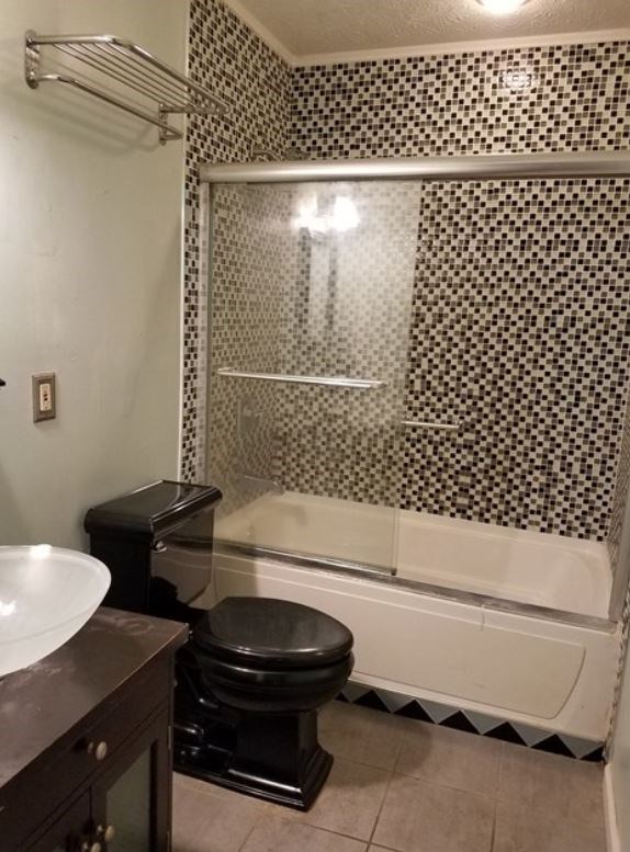 162 31st Avenue Columbus, GA 31903 - Photo 5 of 9 a bathroom with a bathtub and a toilet