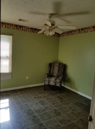 a room with a mirror and a wooden floor