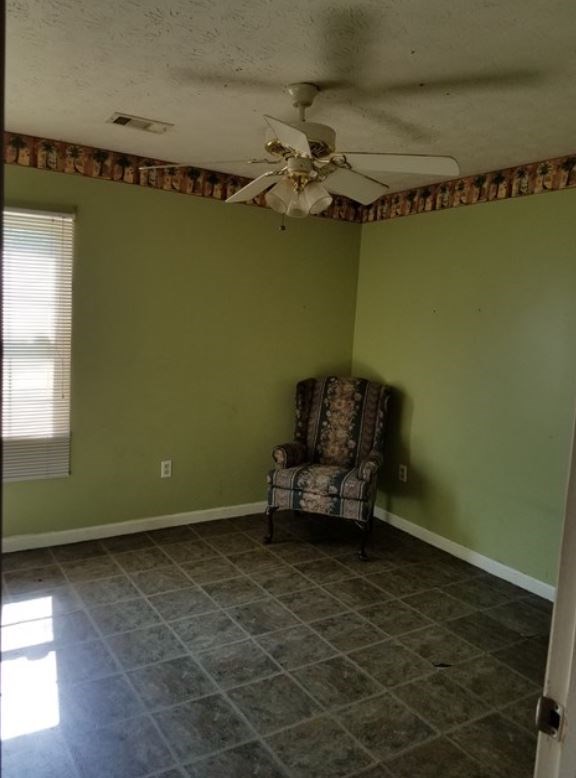 162 31st Avenue Columbus, GA 31903 - Photo 6 of 9 a living room with furniture and a fan