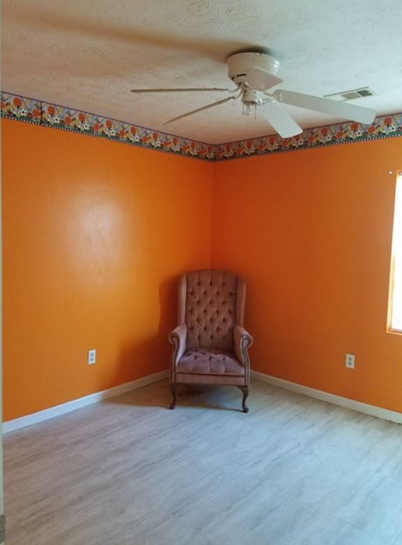 162 31st Avenue Columbus, GA 31903 - Photo 7 of 9 a room with a mirror and a wooden floor