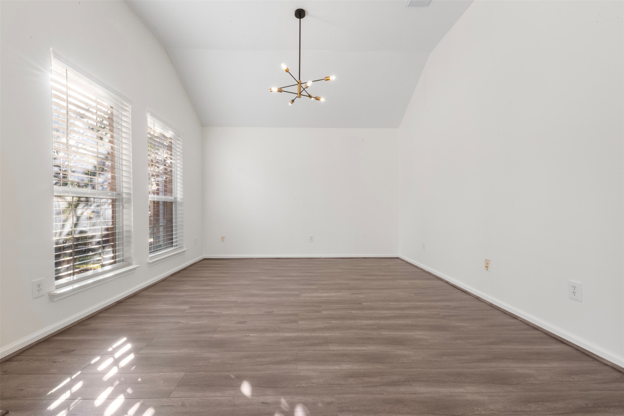 3507 Palomar Valley Drive Spring, TX 77386 - Photo 14 of 22 a view of an empty room with wooden floor and a window