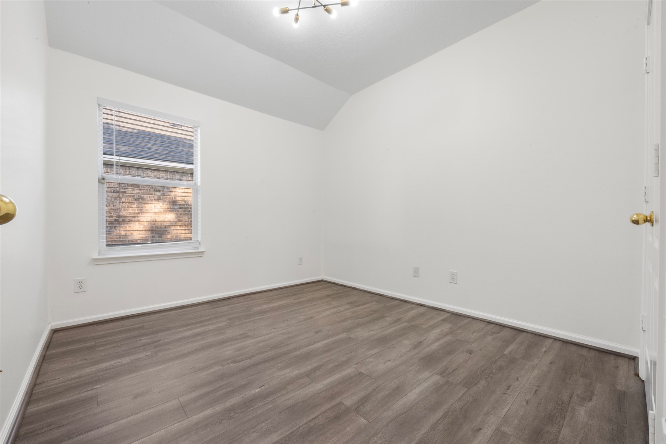 3507 Palomar Valley Drive Spring, TX 77386 - Photo 15 of 22 an empty room with wooden floor and windows
