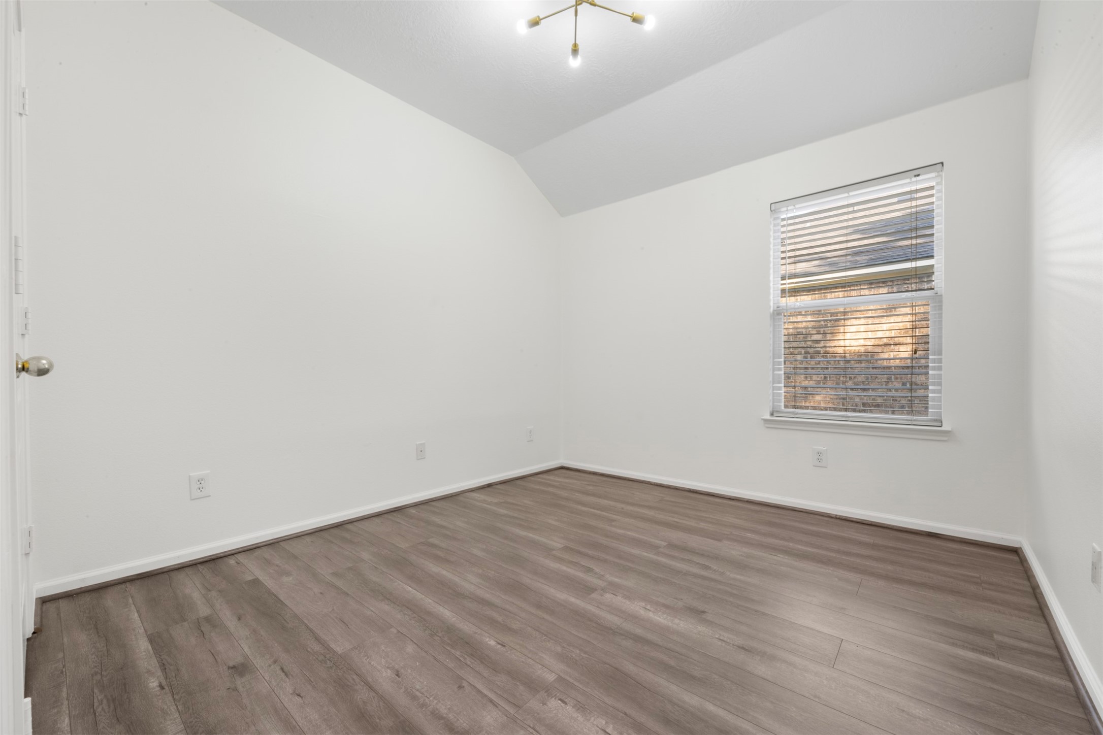 3507 Palomar Valley Drive Spring, TX 77386 - Photo 16 of 22 a view of an empty room with wooden floor and a window
