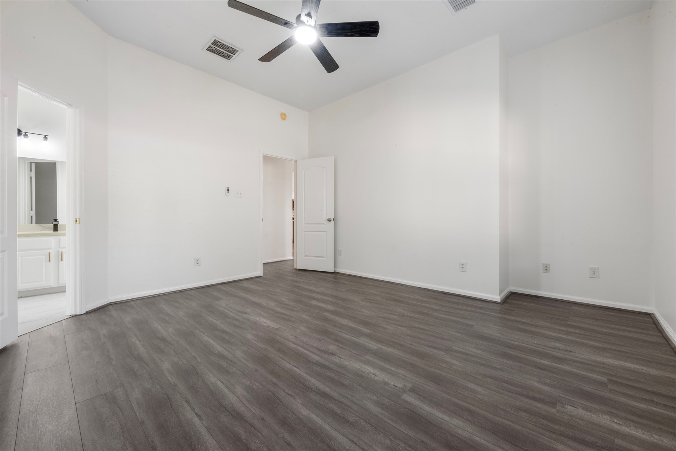 3507 Palomar Valley Drive Spring, TX 77386 - Photo 18 of 22 an empty room with wooden floor and windows