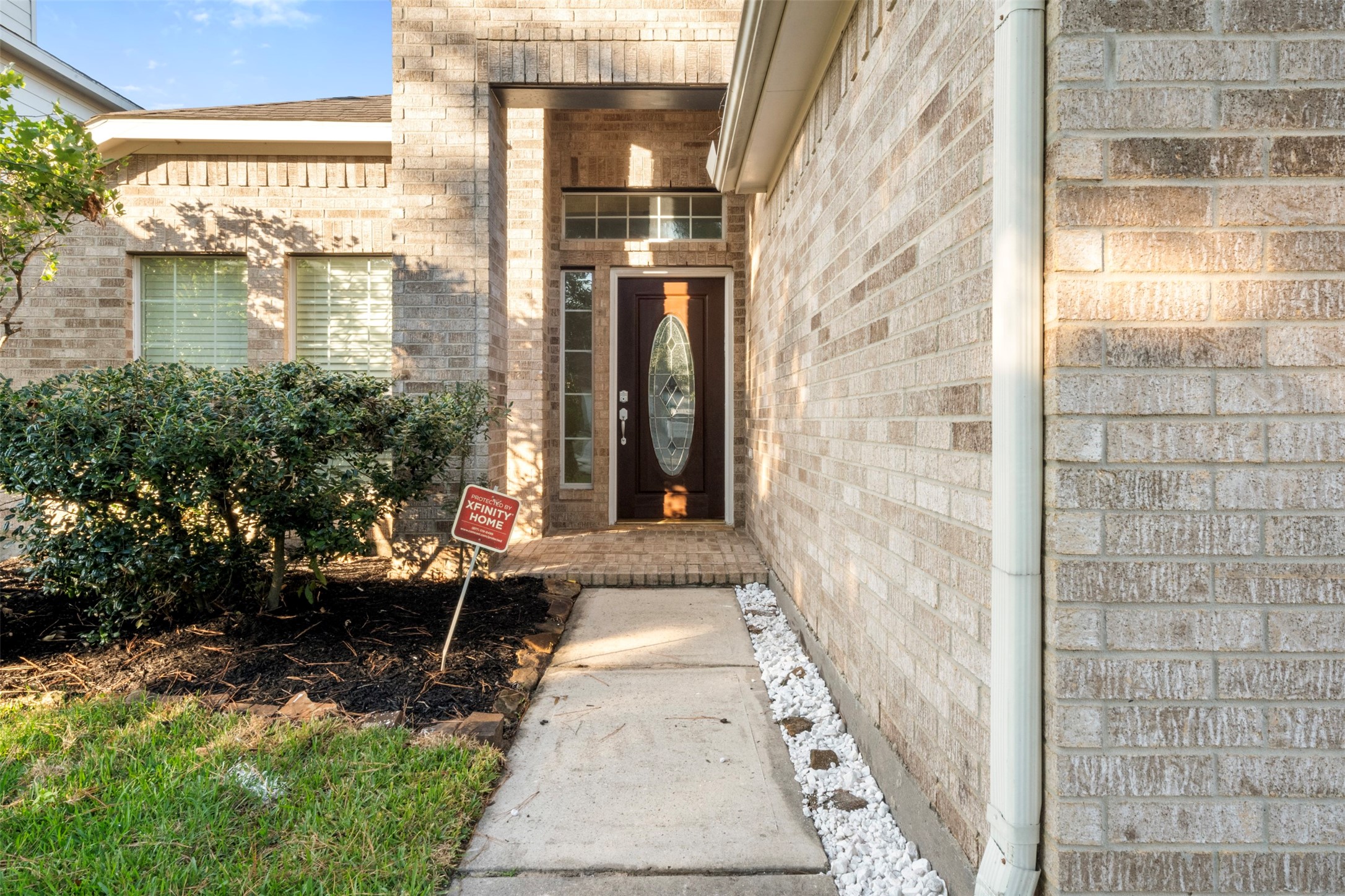 3507 Palomar Valley Drive Spring, TX 77386 - Photo 3 of 22 a view of a brick house with a large windows and a pathway