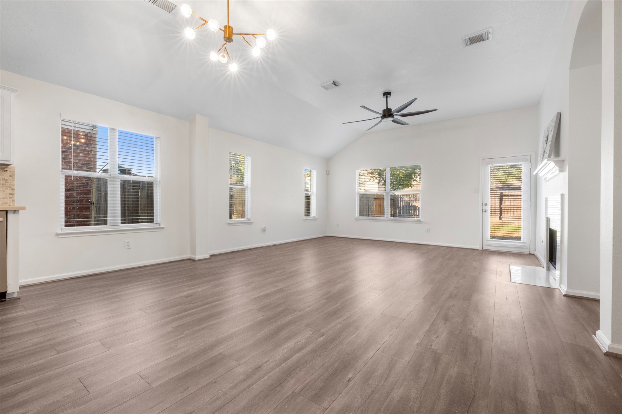 3507 Palomar Valley Drive Spring, TX 77386 - Photo 5 of 22 a view of an empty room with wooden floor and a window