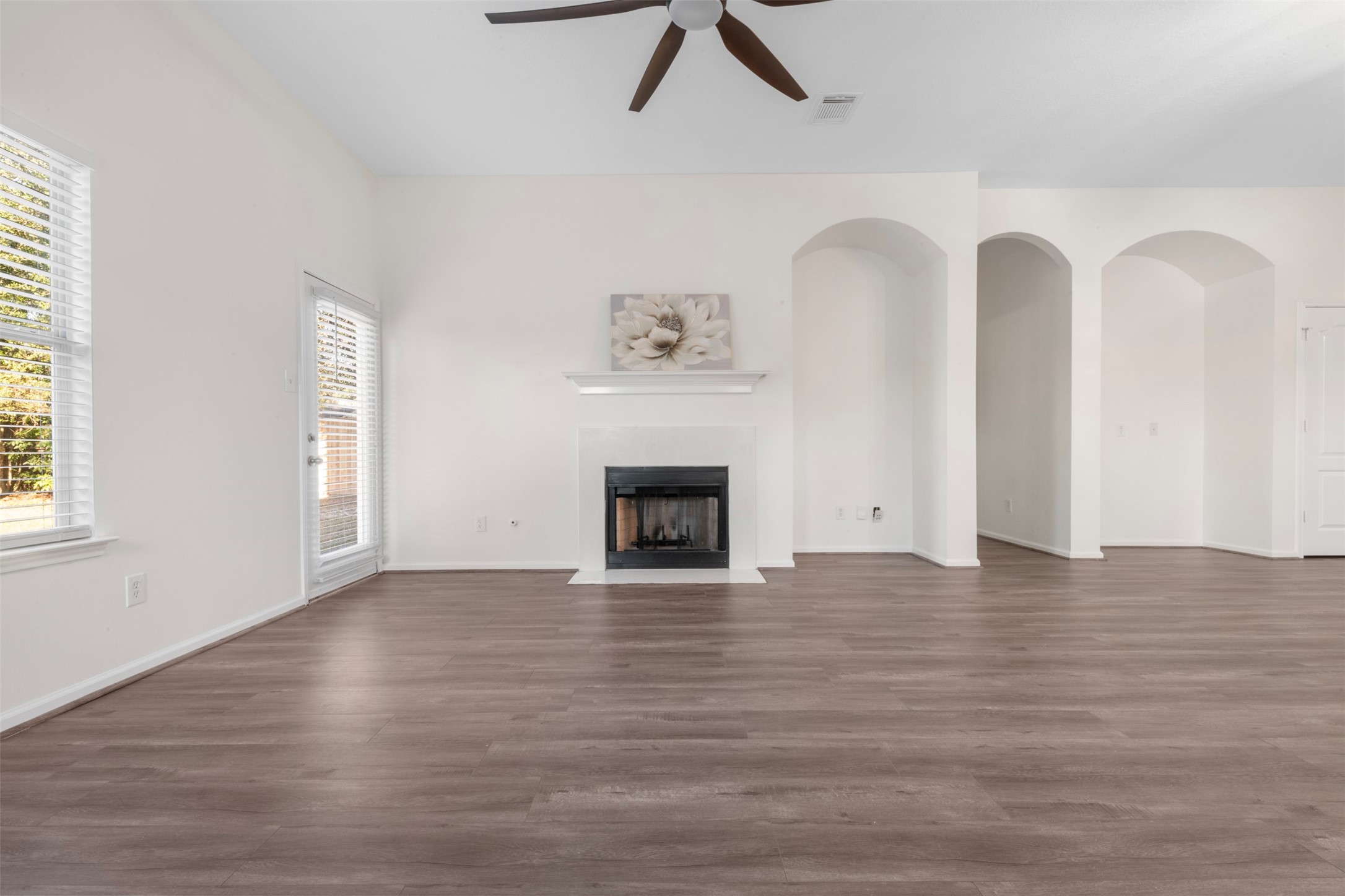 3507 Palomar Valley Drive Spring, TX 77386 - Photo 7 of 22 a view of empty room with wooden floor and fireplace