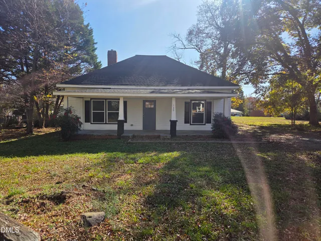 a front view of a house with yard