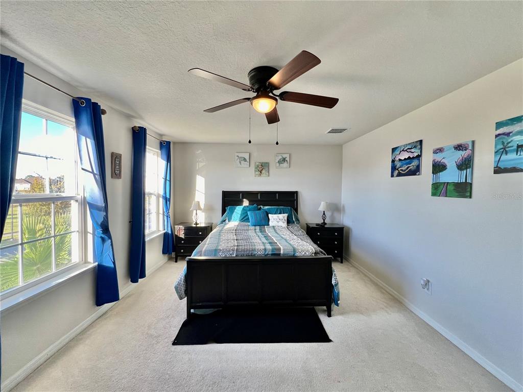 14112 Poke Ridge Drive Riverview, FL 33579 - Photo 24 of 46 a bed in a room next to a window