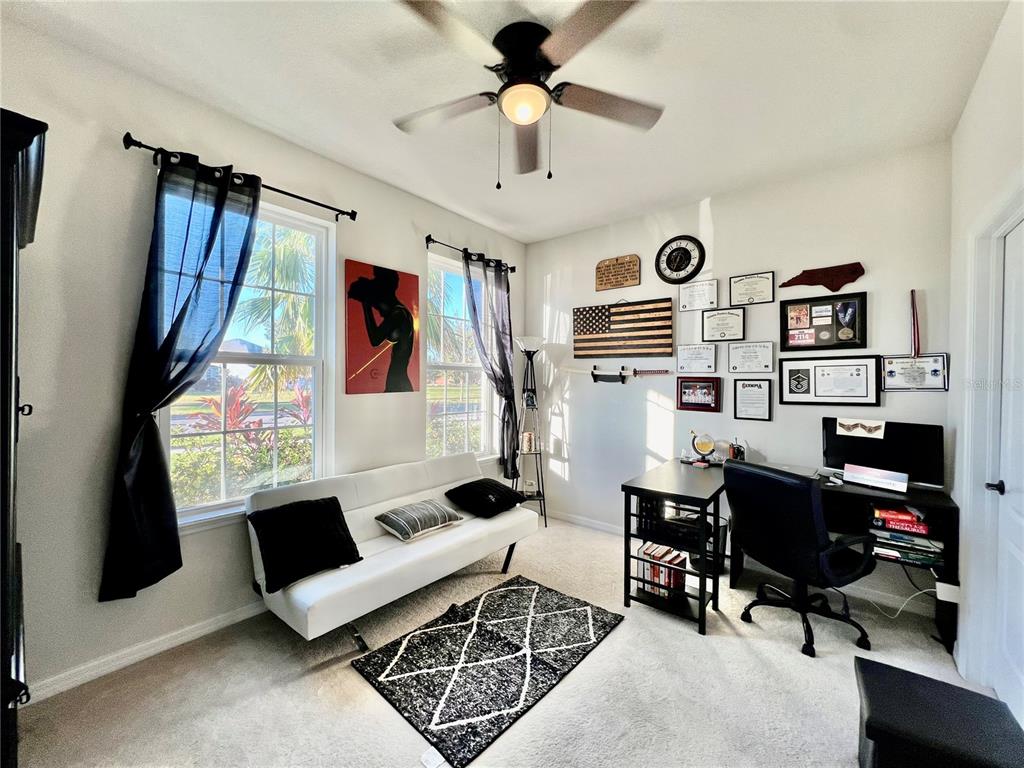 14112 Poke Ridge Drive Riverview, FL 33579 - Photo 29 of 46 a living room with furniture and a flat screen tv