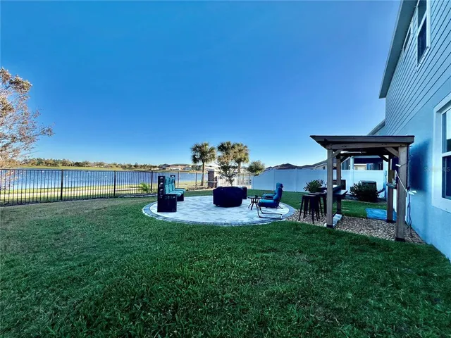 an aerial view of residential houses with outdoor space and swimming pool