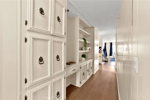 a view of an entryway with wooden floor