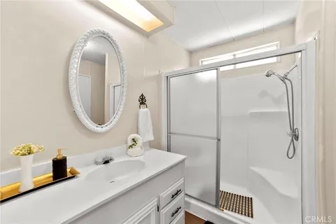 a bedroom with a bed and large window