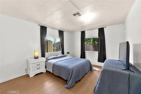 a bedroom with a bed and a couch