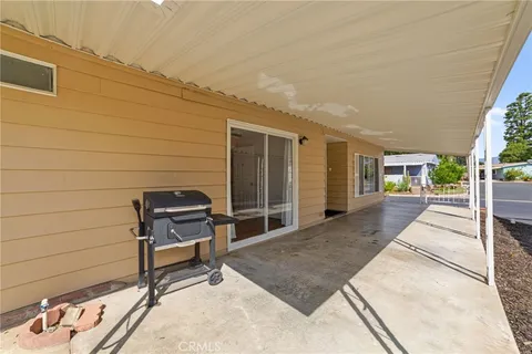 a view of a house with a tree in the background