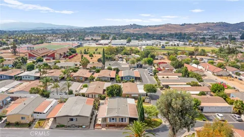 a aerial view of a house with a yard