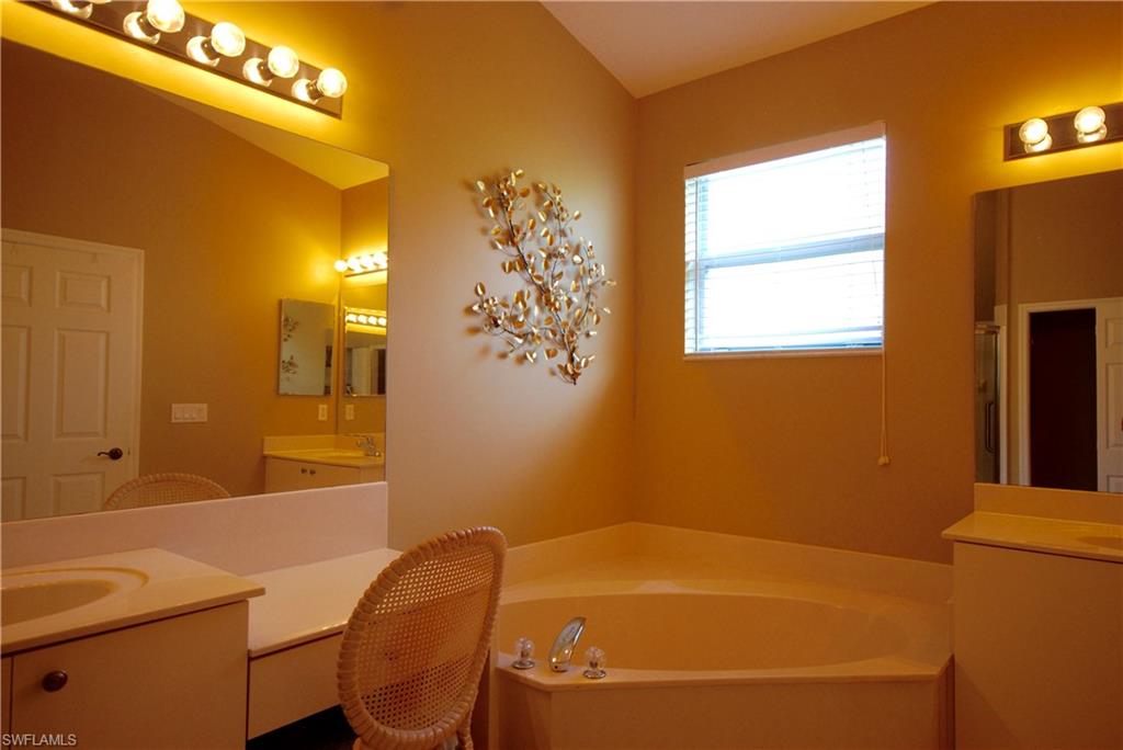 9200 Springview Loop Estero, FL 33928 - Photo 11 of 25 a bathroom with a tub and sink