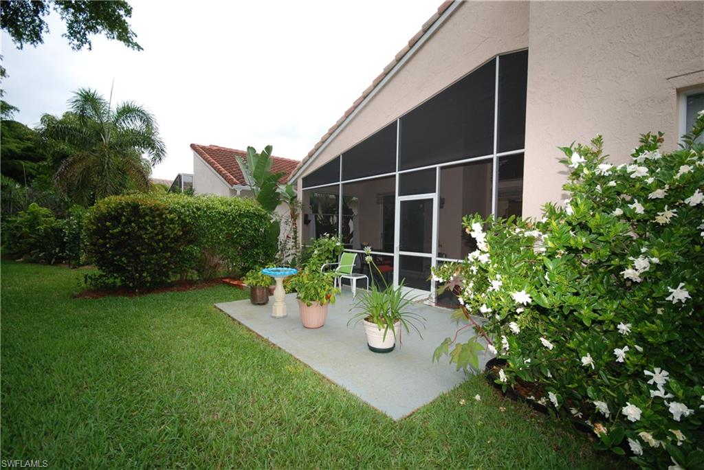9200 Springview Loop Estero, FL 33928 - Photo 14 of 25 a view of a backyard with sitting area and garden