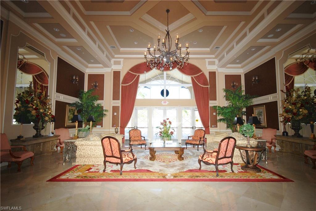 9200 Springview Loop Estero, FL 33928 - Photo 22 of 25 a view of a dining room with furniture a chandelier and a large window