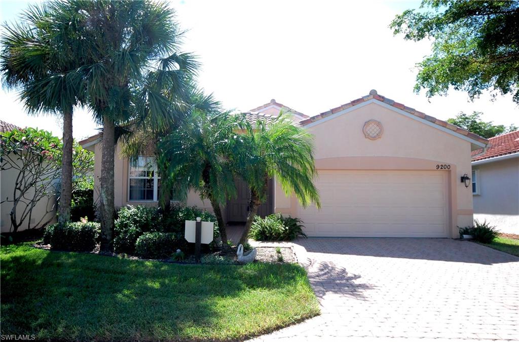 9200 Springview Loop Estero, FL 33928 - Photo 3 of 25 a front view of house with yard and green space