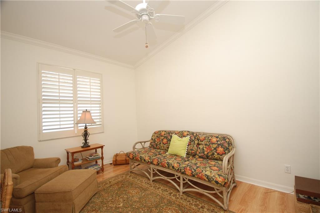 9200 Springview Loop Estero, FL 33928 - Photo 7 of 25 a bedroom with a bed and chair