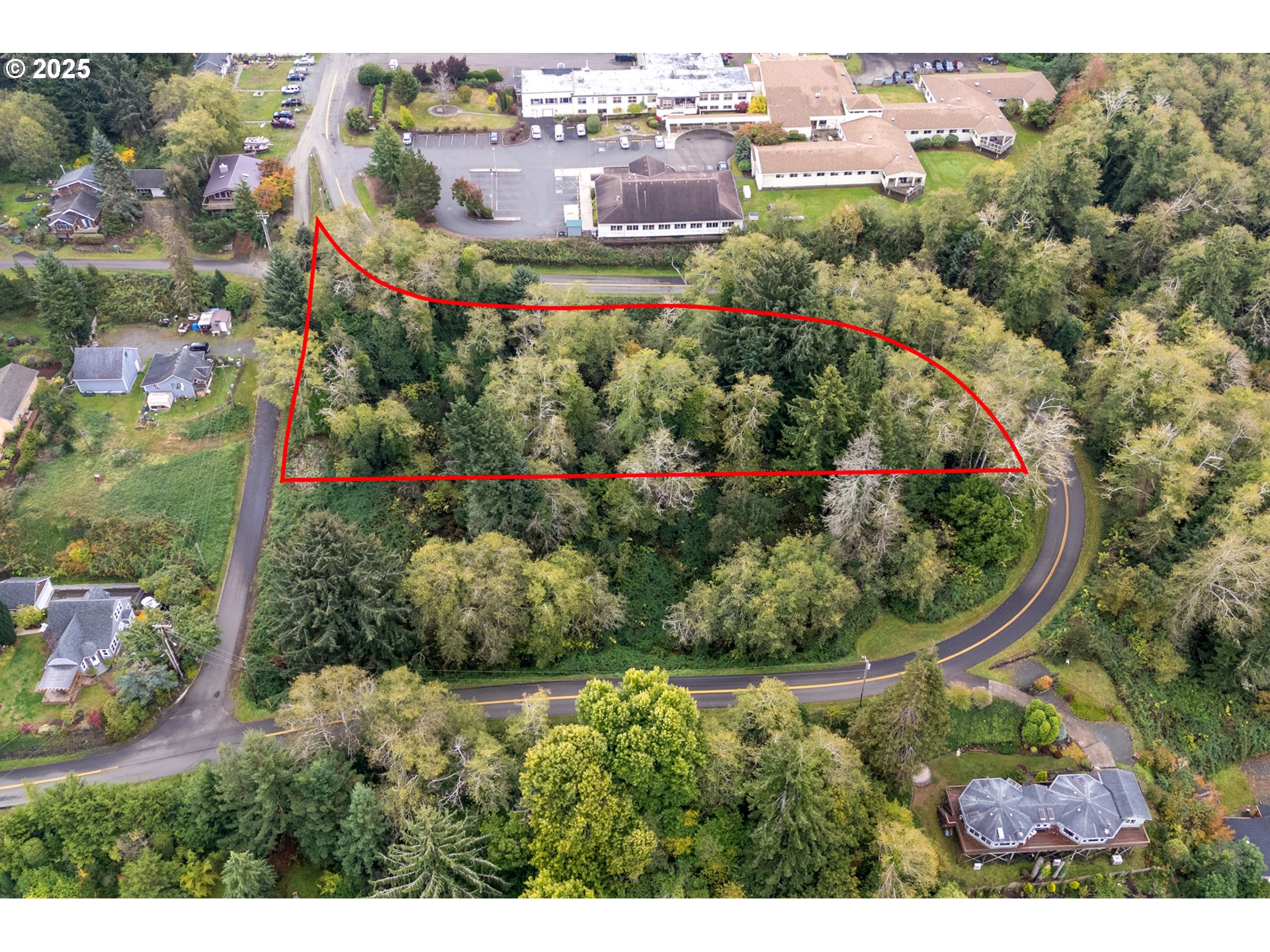 Rowe Street, Unit 1800 Wheeler, OR 97147 - Photo 2 of 11 an aerial view of residential house with outdoor space and trees