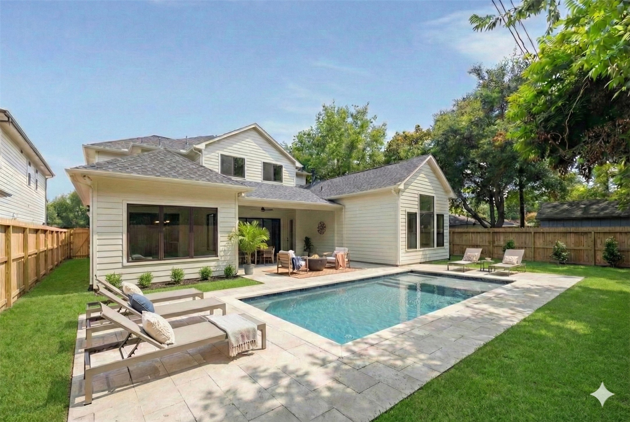 1201 Confederate Road Houston, TX 77055 - Photo 2 of 33 The ultimate backyard escape awaits. A stunning visualization of modern outdoor living. This design features a refreshing rectangular pool surrounded by an expansive travertine paver patio, dedicated lounging zones, and a comfortable covered seating area. (Please note: This is a digitally rendered image.)