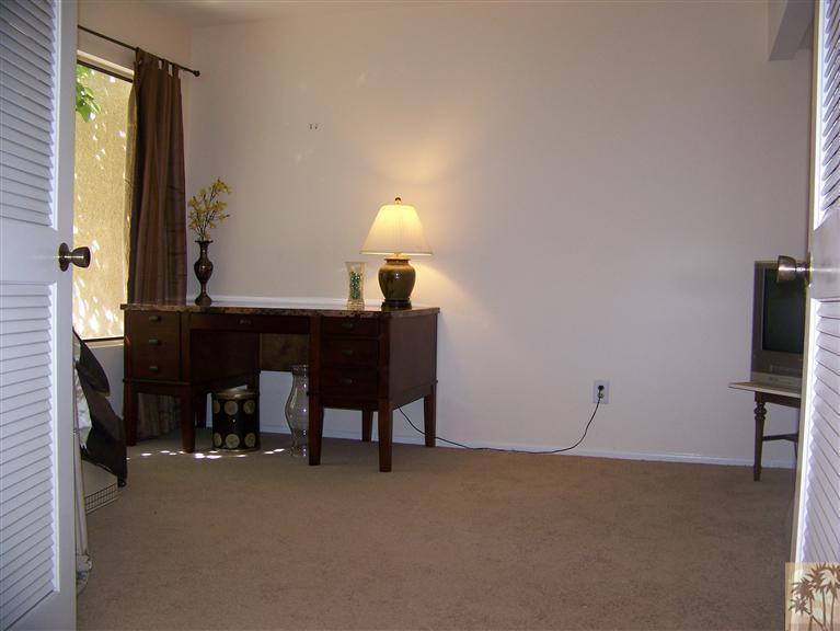 72400 Ridgecrest Lane Palm Desert, CA 92260 - Photo 11 of 25 a lamp on a table in a room