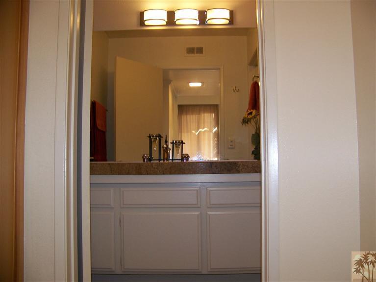 72400 Ridgecrest Lane Palm Desert, CA 92260 - Photo 12 of 25 a bathroom with a sink and a mirror