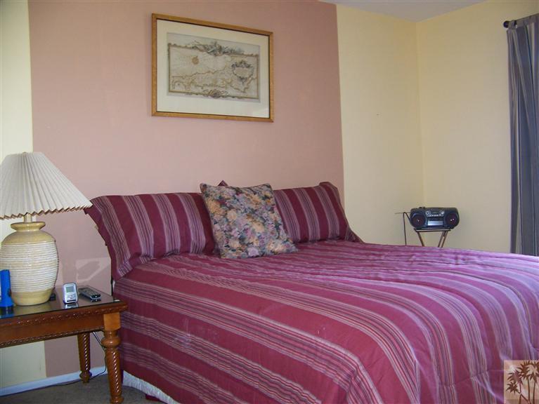 72400 Ridgecrest Lane Palm Desert, CA 92260 - Photo 14 of 25 a bedroom with a bed and a lamp on dresser