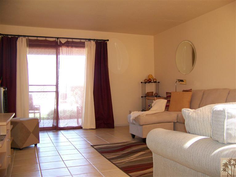 72400 Ridgecrest Lane Palm Desert, CA 92260 - Photo 15 of 25 a living room with furniture and a window