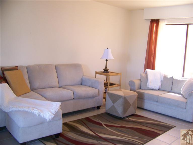 72400 Ridgecrest Lane Palm Desert, CA 92260 - Photo 16 of 25 a living room with furniture and a window