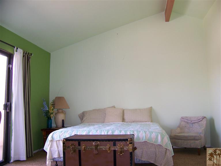 72400 Ridgecrest Lane Palm Desert, CA 92260 - Photo 19 of 25 a bedroom with a bed and a chair