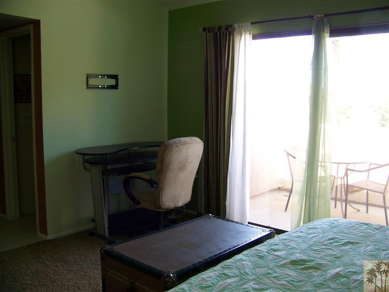 72400 Ridgecrest Lane Palm Desert, CA 92260 - Photo 20 of 25 a view of workspace filled with furniture and a window