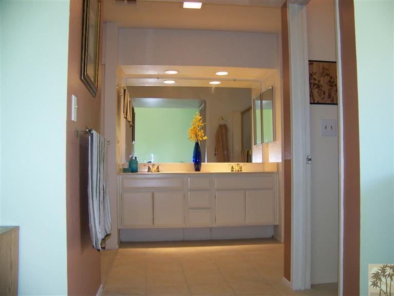 72400 Ridgecrest Lane Palm Desert, CA 92260 - Photo 21 of 25 a bathroom with a sink mirror and vanity