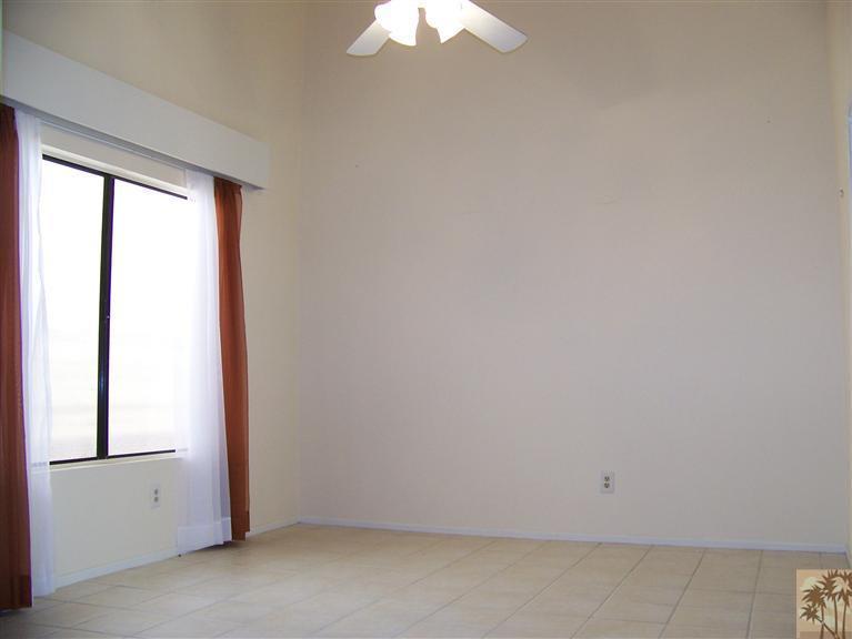 72400 Ridgecrest Lane Palm Desert, CA 92260 - Photo 6 of 25 an empty room with a window