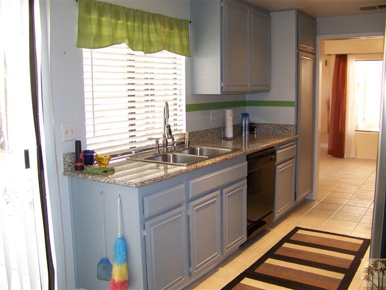 72400 Ridgecrest Lane Palm Desert, CA 92260 - Photo 9 of 25 a kitchen with a sink and a window
