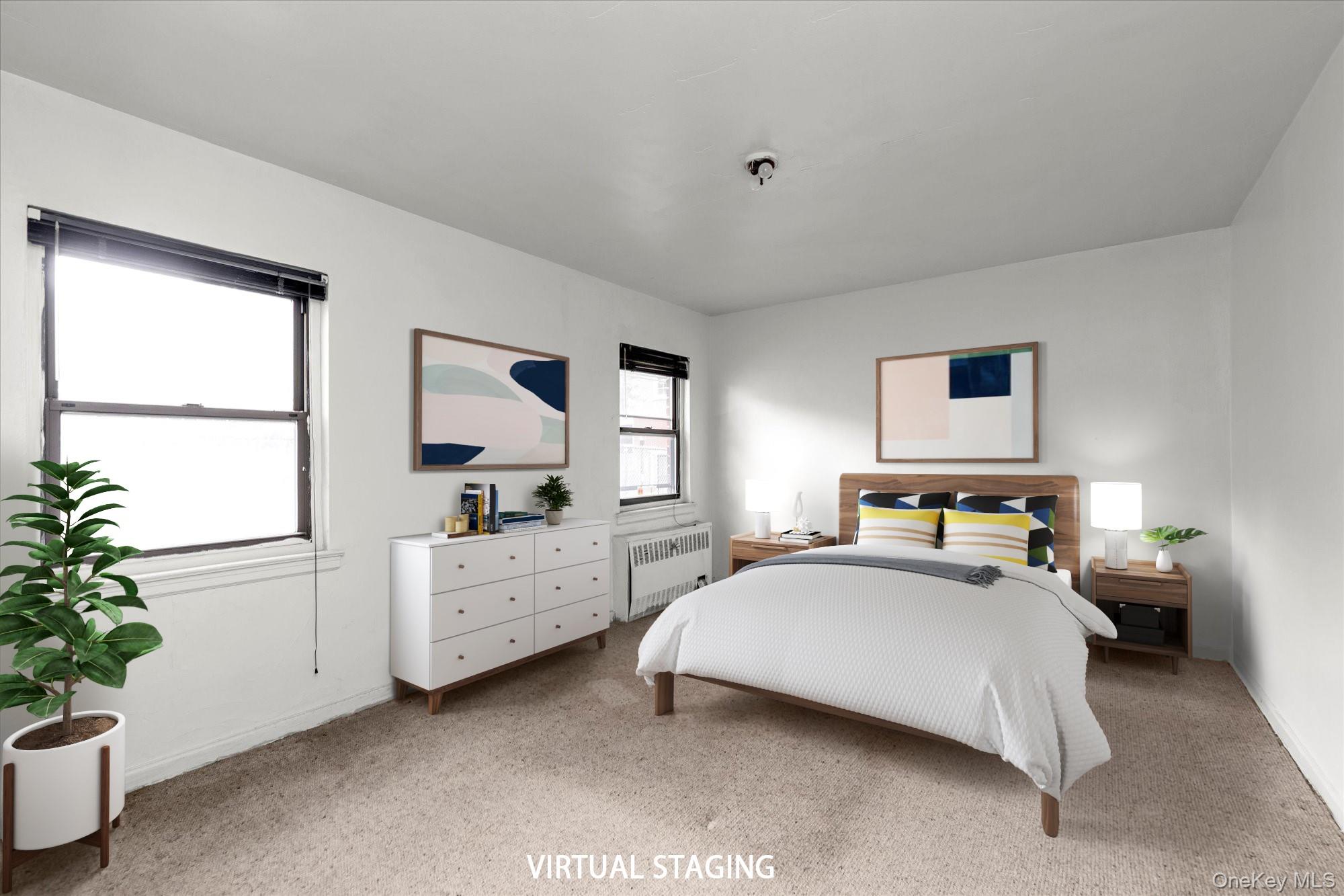 196-32 69th Avenue, Unit 1 Queens, NY 11365 - Photo 8 of 21 Bedroom with light carpet and radiator